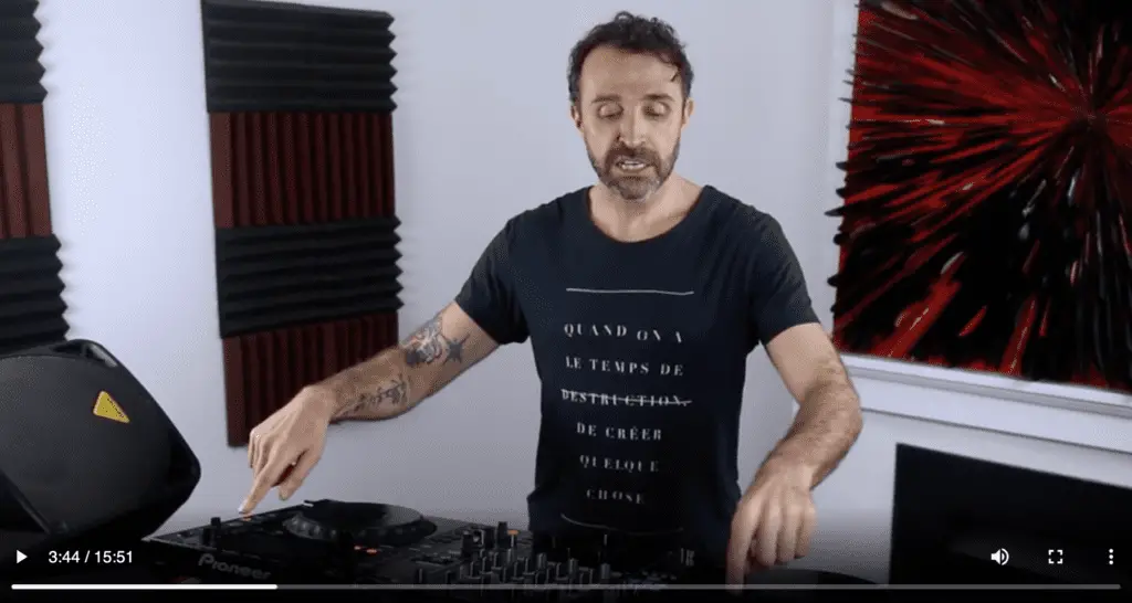 andrew duffield explaining DJing in front of a DJ controller